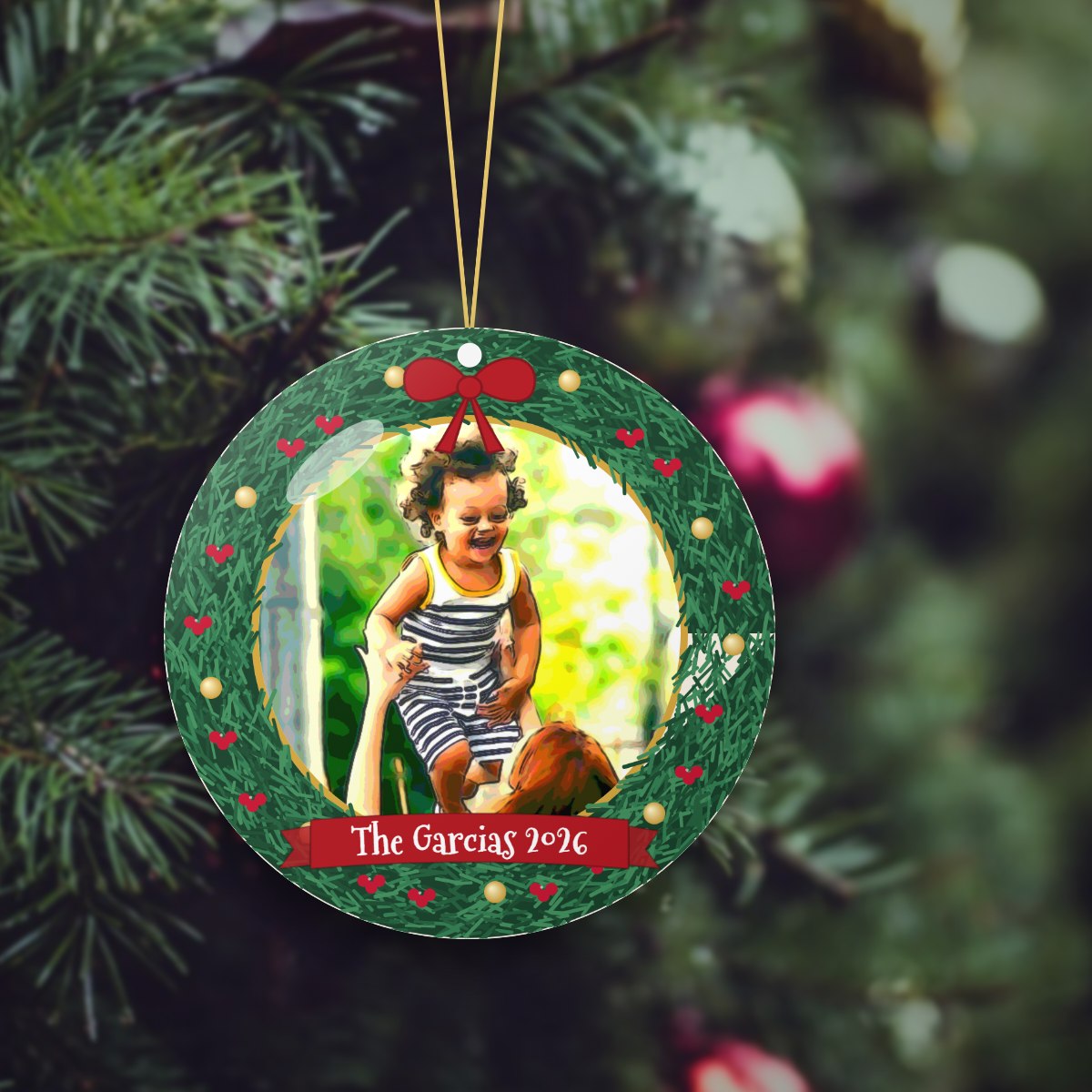 Personalized family photo Christmas ornament on a tree